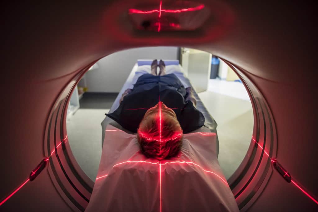 Image of Patient lying inside a medical scanner in hospital