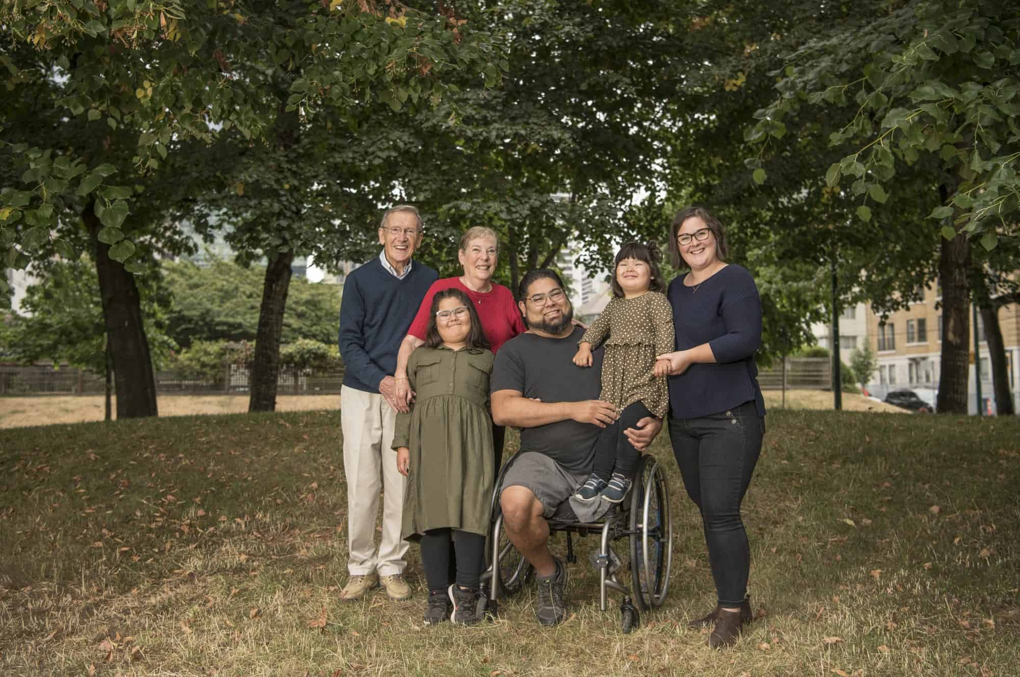A man that survived a flesh-eating disease, which caused amputation, and a six month stay at St. Paul’s Hospital, seen with his family.
