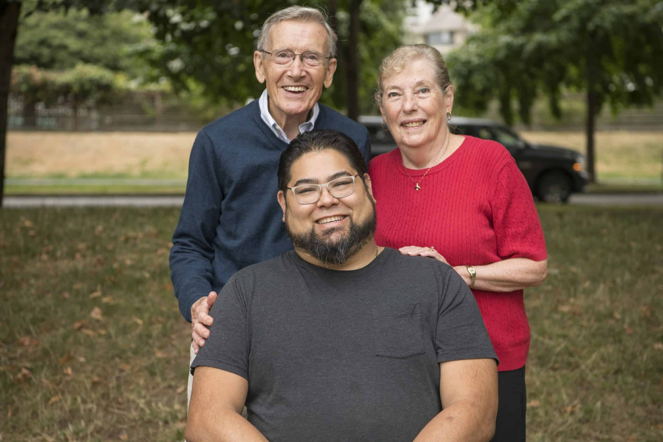 A mother and father with their son who survived a flesh-eating disease that caused amputation and required a six month stay at St. Paul’s Hospital.