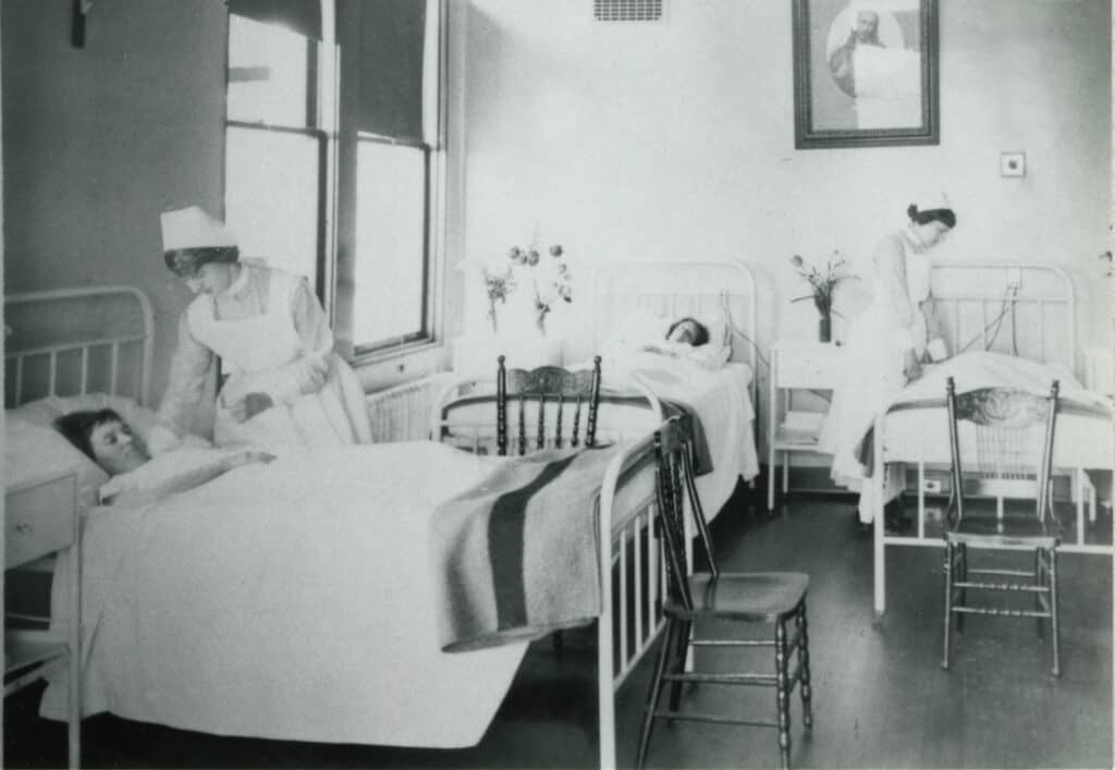 Image of Student nurses tending to patients at St. Paul's Hospital in 1919.