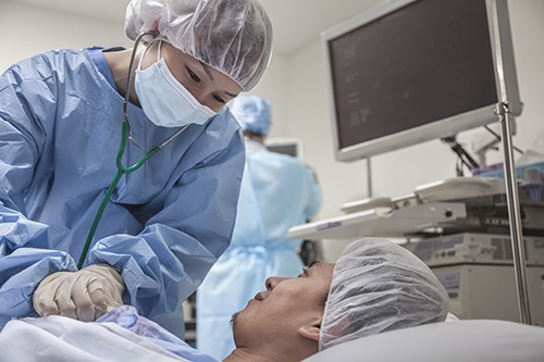 Image of Surgeon consulting a patient, getting ready for surgery