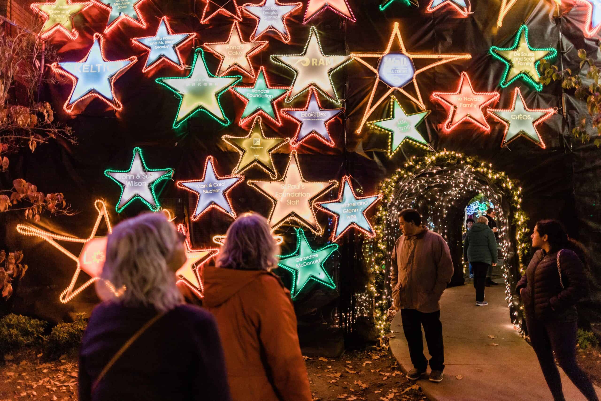 People walking through the Lights of Hope Display, 2022