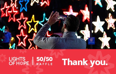 Banner image: photograph of person photographing the Lights of Hope display, with text at the bottom that reads "Lights of Hope 50/50 raffle - Thank you."