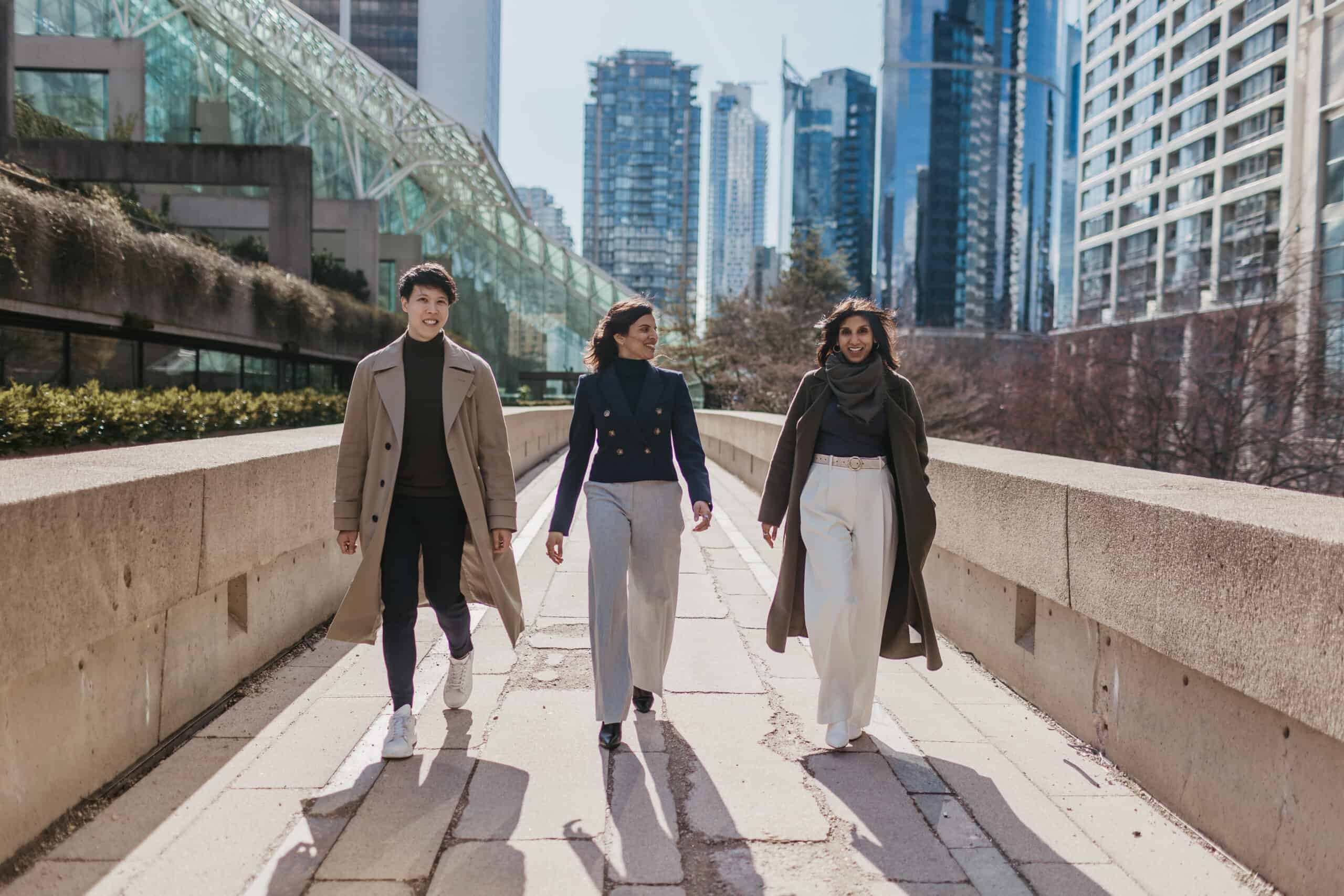 Three people - all affiliated with the MedSafe Clinic - walking in Vancouver