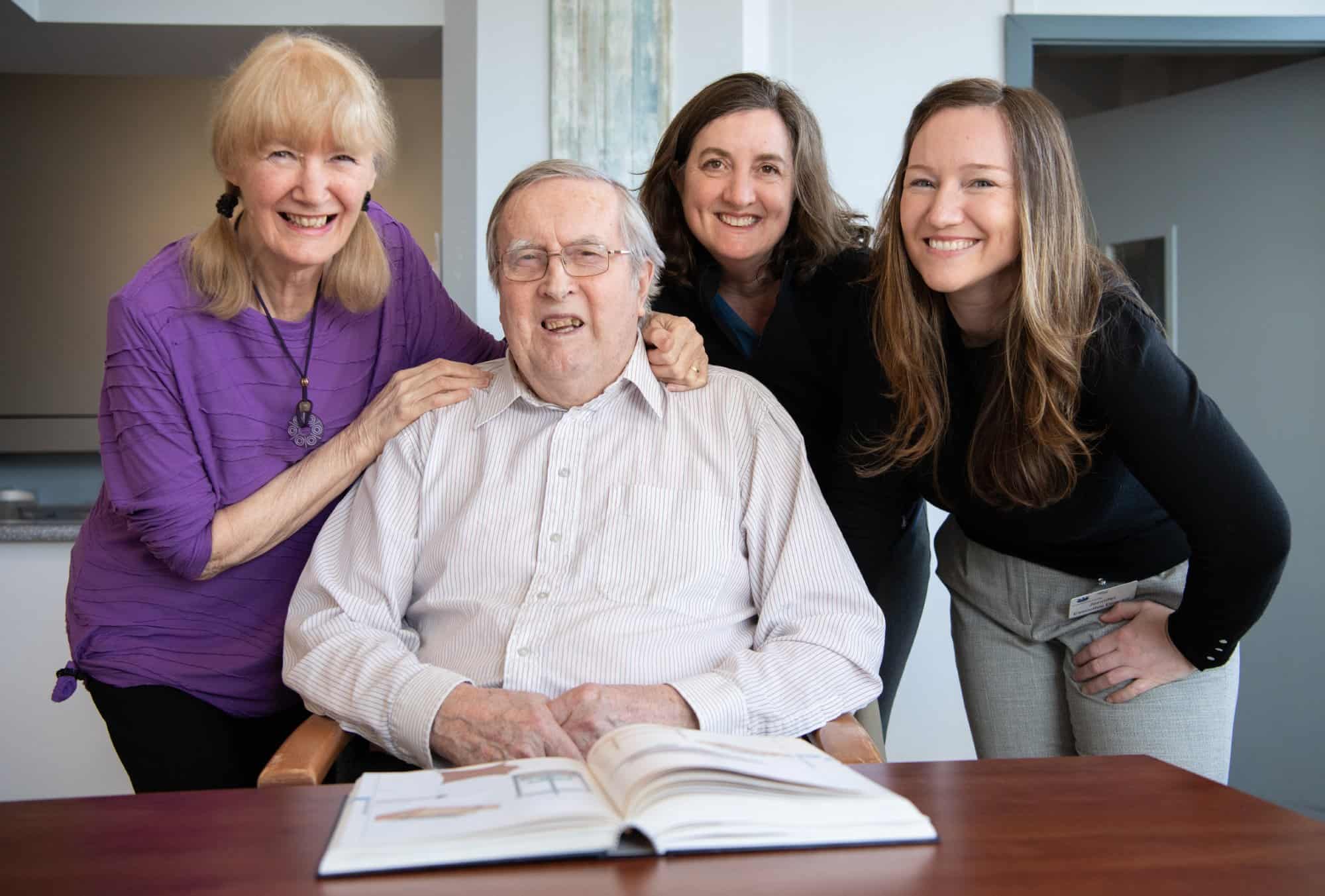 Judi Wild-Hutter, whose husband is a resident at Providence Living at The Views, Lorne Hutter, Judi’s husband, Shepherd, and Dr. Gibson.