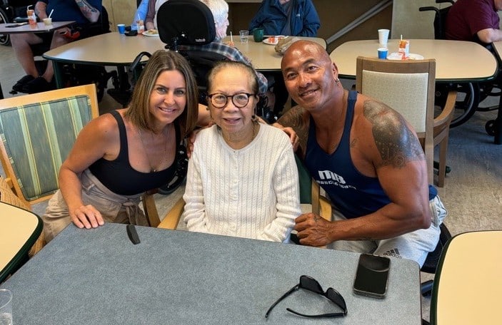 Natividad “Naty” Parinas (centre), with her son Eddie Parinas (right) and daughter-in-law Allie Sellers (left) at Providence Living at The Views.