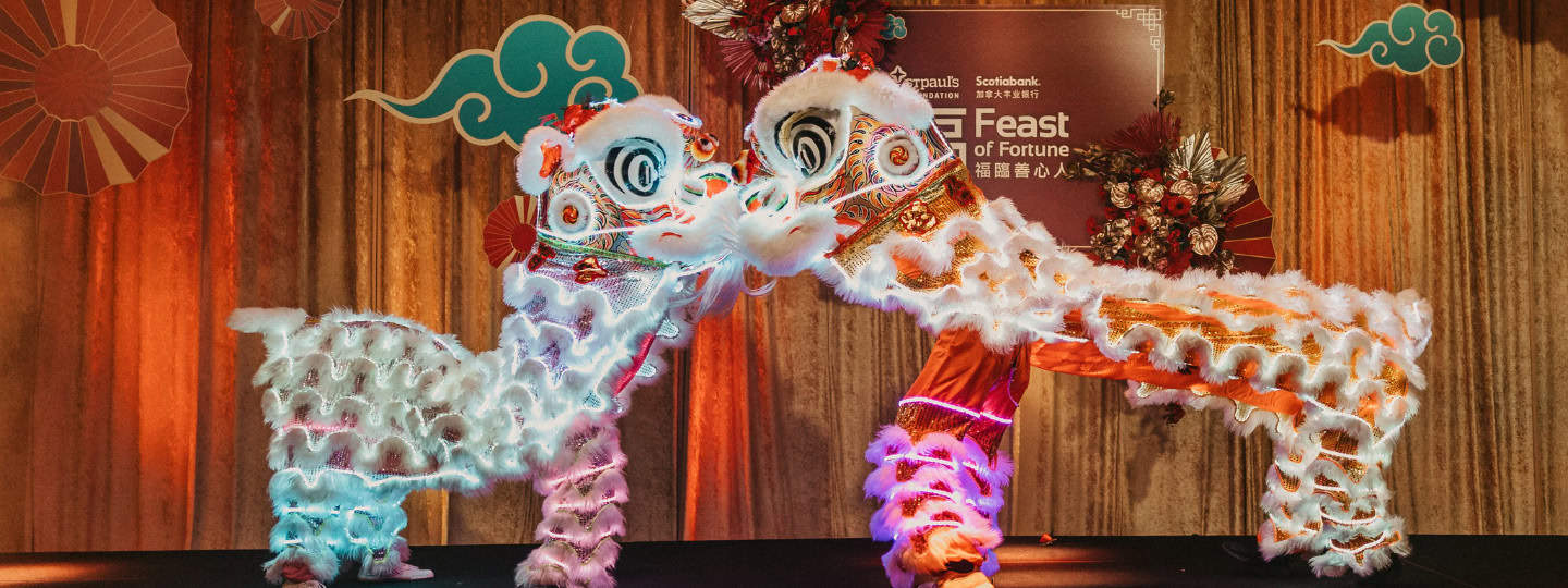 Lion dancers on stage at the 2024 Scotiabank Feast of Fortune gala.