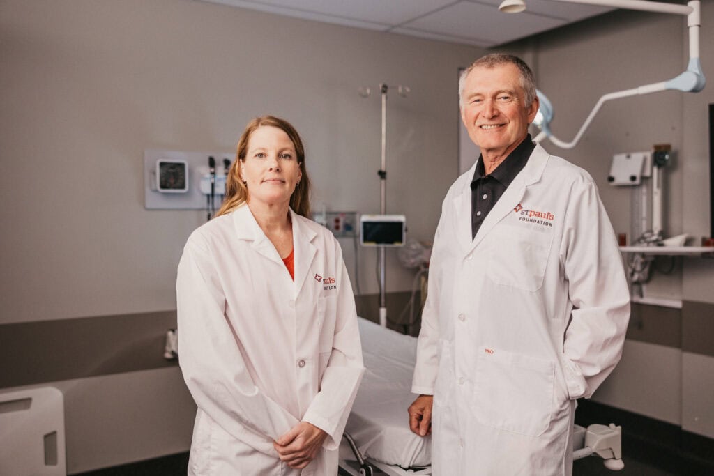 Dr. Erin Kenny (left) and Dr. Jim Christenson (right) at St. Paul’s Hospital’s Teck Emergency Centre, leading clinical care and groundbreaking research to improve emergency treatment.