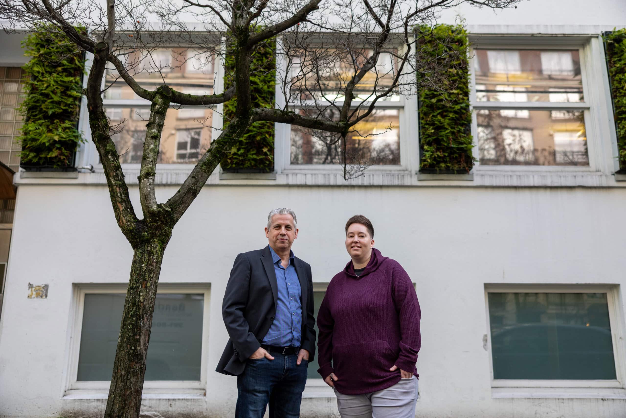 Steve Mathias, executive director at Foundry, and Amanda Horne, peer support worker and former Foundry client, standing in front of the new Foundry Vancouver-Downtown building at 1220 Homer Street.