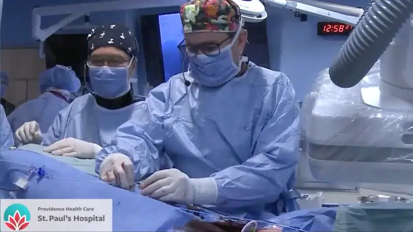 Clinical team at St. Paul’s Hospital work at the bedside during a heart procedure.